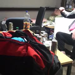 Guy trying to put on a pair of Pants as a Shirt
