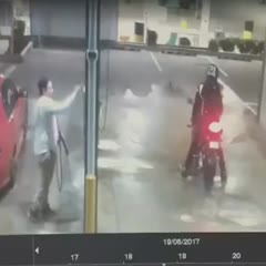 CCTV captured the moment a man damaged his motorbike at a car wash in ...
