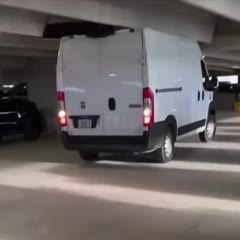 Van Hits the Sign and Celling in a Parking Lot
