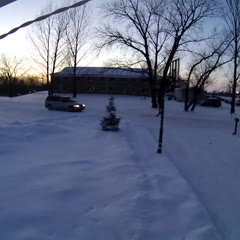 Snowmobile Crashes Into Garage Moments After Owners Leave