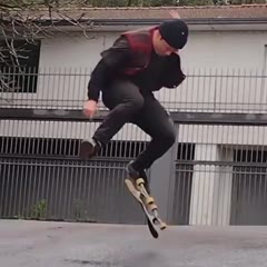 Skateboarder Riding Down the Slope Narrowly Misses Collision With Passing Car