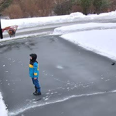 Kid's Basketball Gets Stuck Inside Frozen Basket During Cold Weather