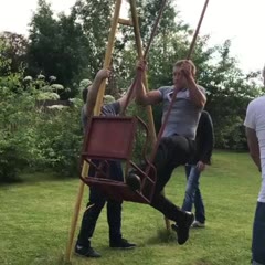 Man flies, crashes into wall when attempting a trick on a swing