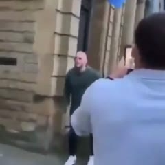 Stupid man intentionally headbutts a signboard