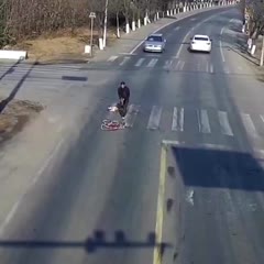 Chinese cyclist lucky to survive after rolling under truck - but his bike gets crumpled
