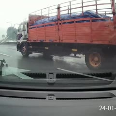 Motorcyclist Nearly Run Over After Crashing on Highway