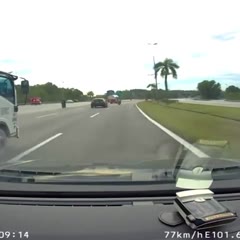Motorcycle rider miraculously survives after lorry tarpaulin comes loose and knocks him into a fuel