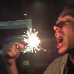 Guy puts a sparkler in his mouth