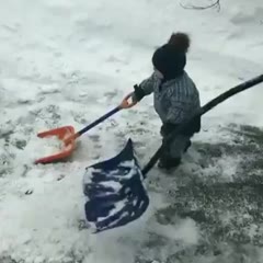 Helping his Dad shovel snow