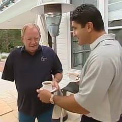 Mario Fenech gives One armed man a Cup and Saucer.
